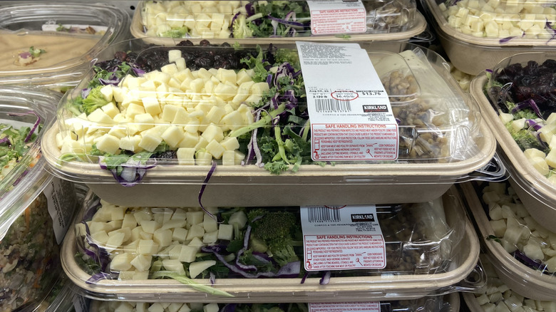a handful of broccoli salad kits