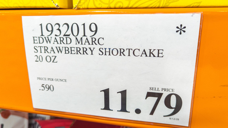 A Costco price tag features an asterisk in the corner.