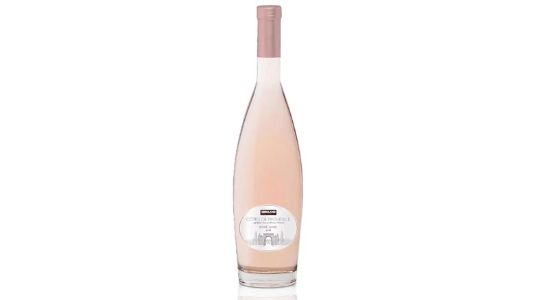A bottle of Kirkland Signature Cotes de Provence Rosé sits on a stone counter.
