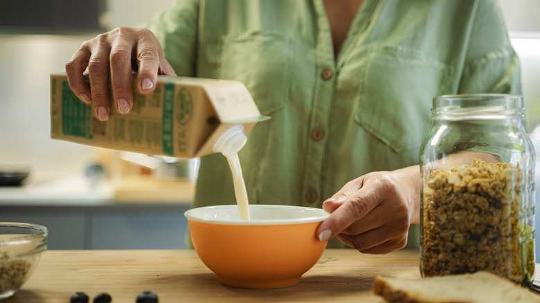 Pouring milk in bowl