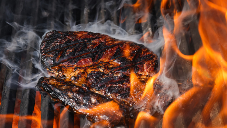 Steak overcooking on fire