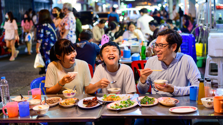 Family eating at outdoor restaurant