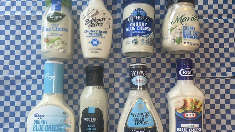 Eight blue cheese dressings on a blue checkered backdrop