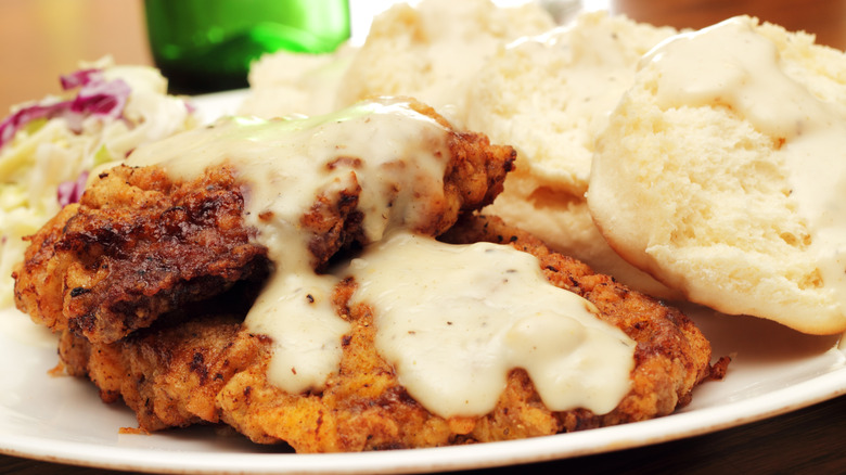 Chicken fried steak with gravy and sides