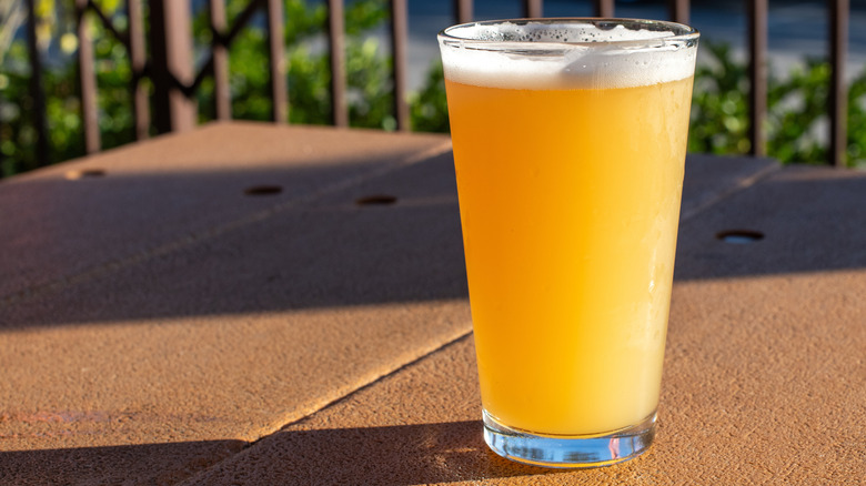 Glass of IPA on an outdoor tabletop
