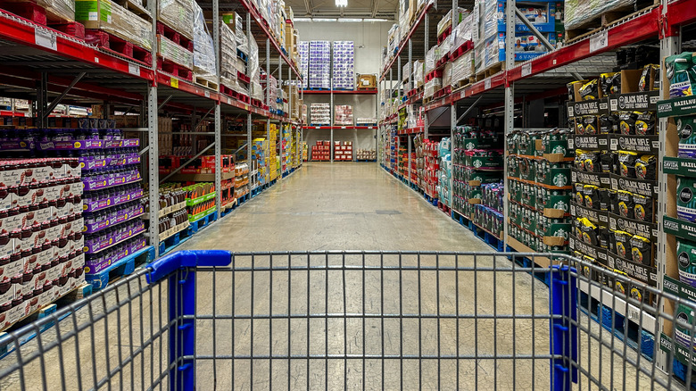 Shopping cart pointing down aisle in sam's club