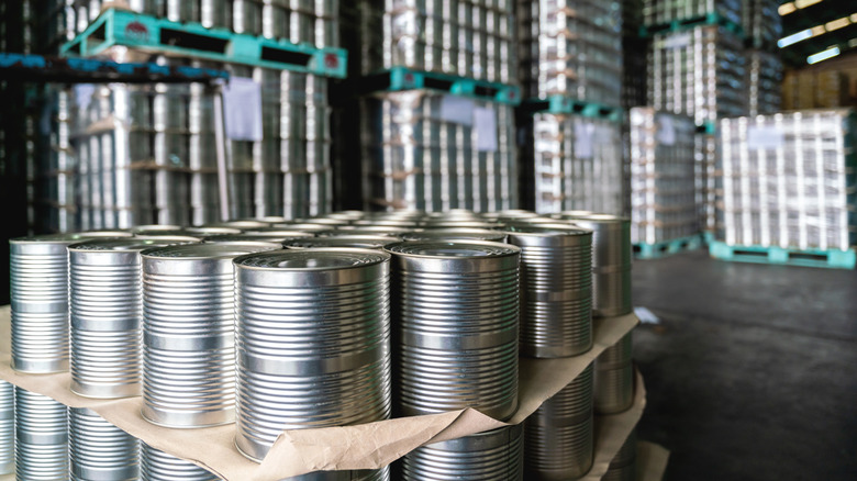 Cans stacked in warehouse