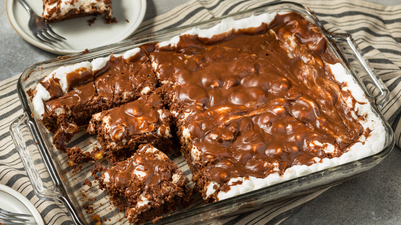 Mississippi mud pie in a glass baking dish that has some missing