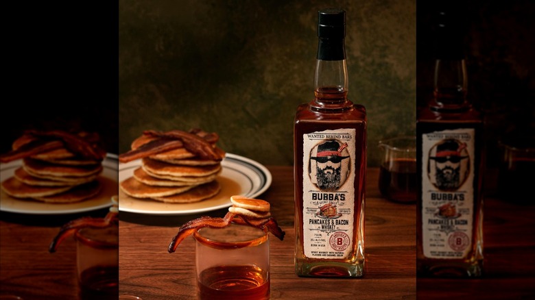 Bottle of Bubba's Pancakes & Bacon with glass and actual plate of pancakes and bacon