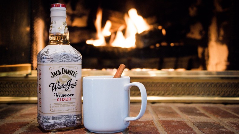 Bottle of Winter Jack with coffee mug in front of fireplace