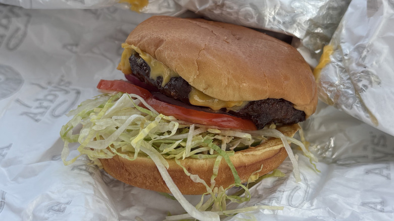 Arby's cheeseburger in fast food wrapper