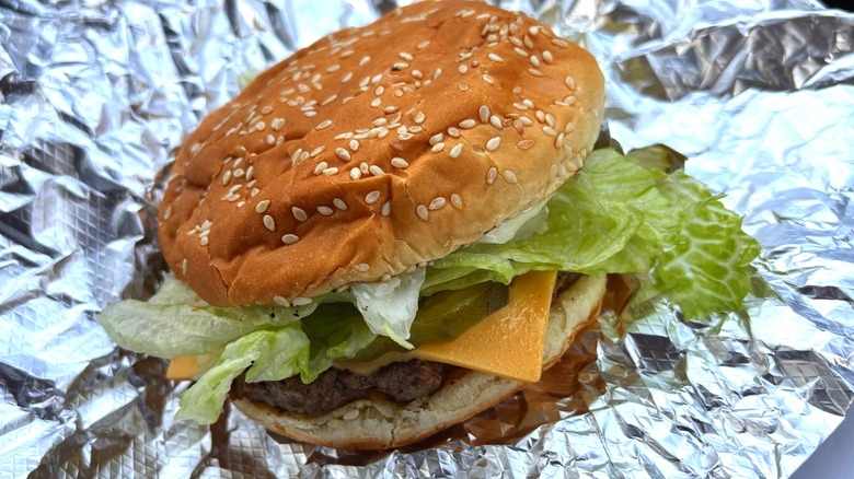 Five Guys cheeseburger with single burger patty on sesame seed bun