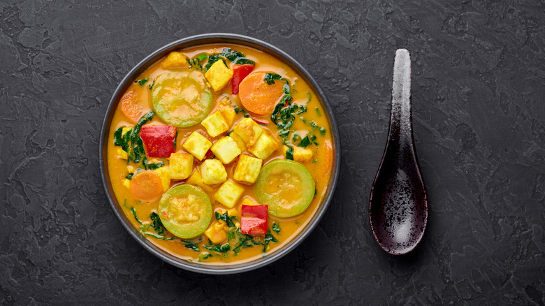 Bowl of coconut curry with vegetables