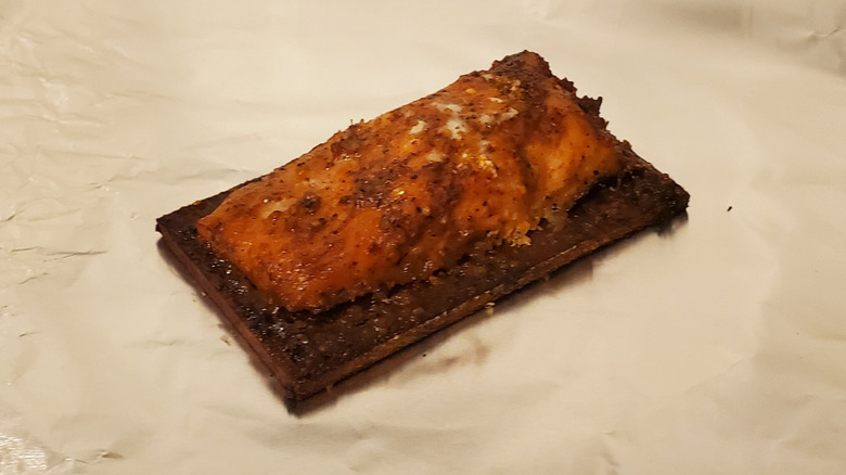 A salmon fillet on a cedar plank
