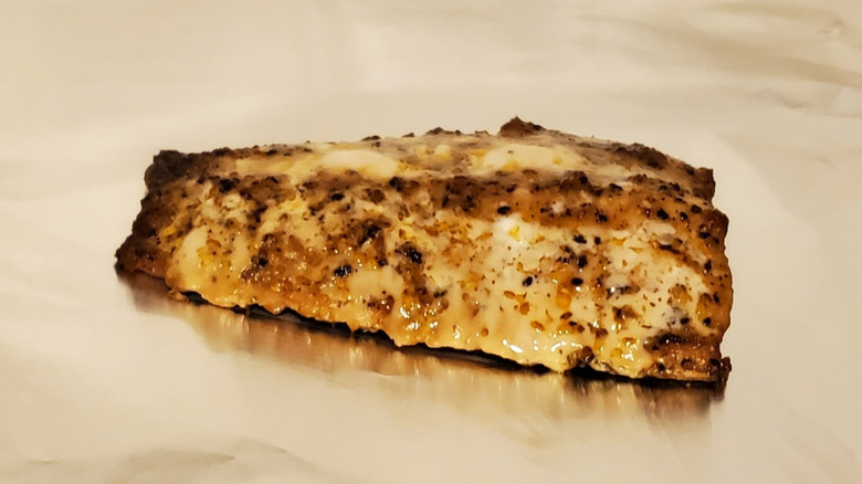 A seasoned, crispy cooked salmon fillet