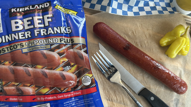 Kirkland hot dog package with hot dog and knife and fork with peppers