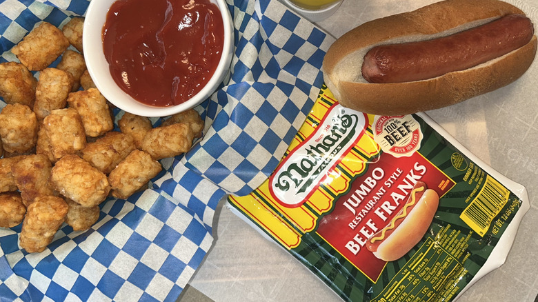 Nathan's Famous hot dog package with hot dog and tater tots with ketchup