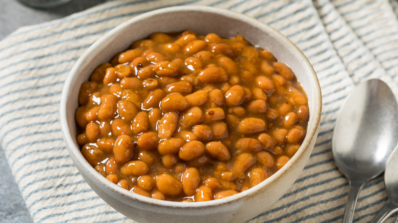 White bowl of barbecue baked beans