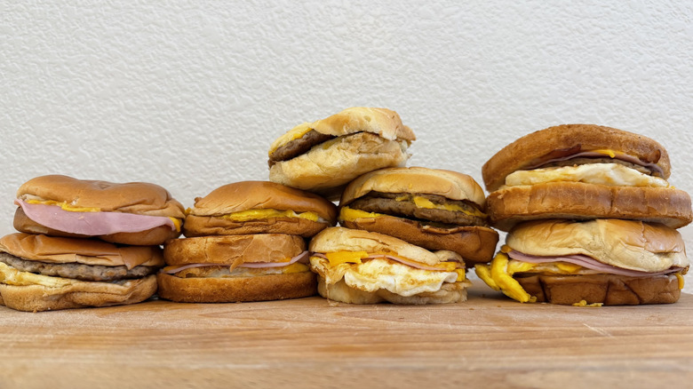 Nine Jack in the Box breakfast sandwiches stacked in a pile