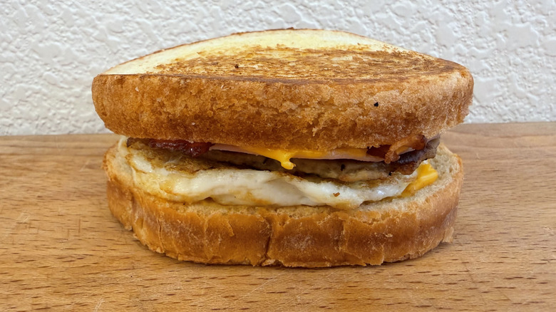 Loaded Breakfast Sandwich with egg, cheese, bacon, ham, and sausage