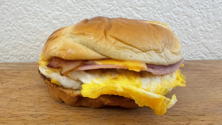 Ultimate Breakfast Sandwich with ham, bacon, cheese, and egg
