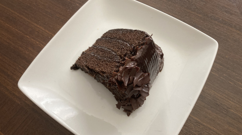 Kroger four layer fudge iced chocolate cake slice on plate