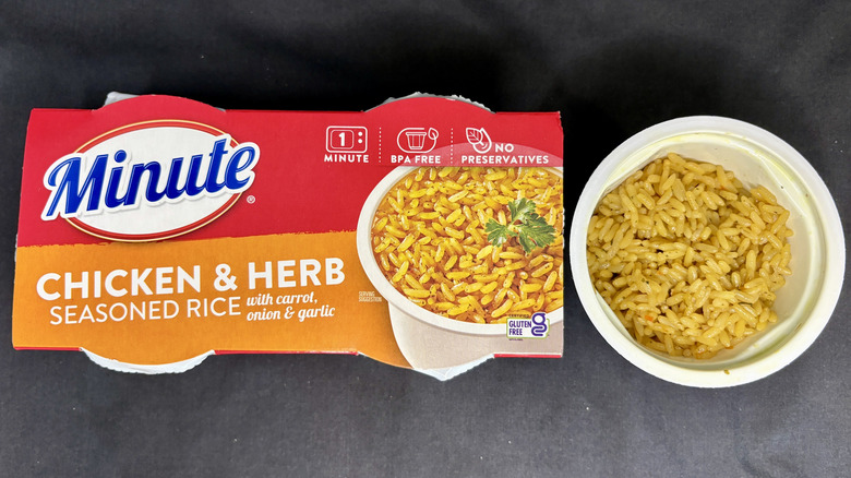 Bowl of rice next to Minute Chicken and Herb Seasoned Rice package