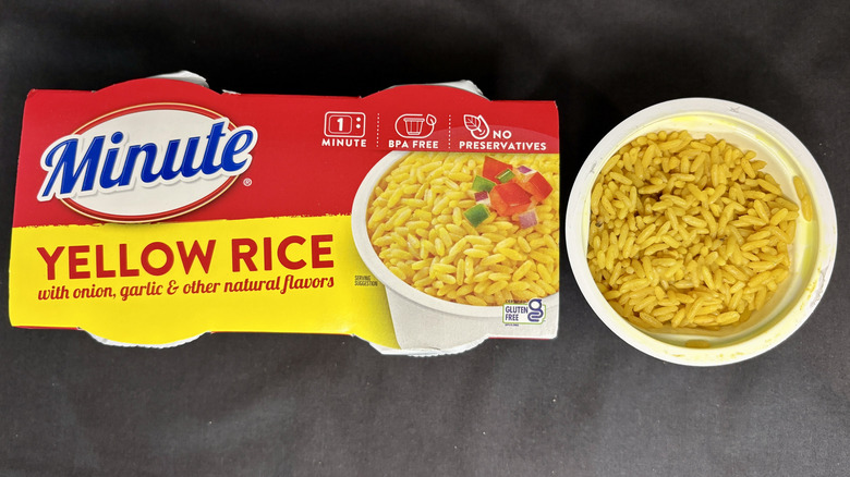 Bowl of rice next to Minute Yellow Rice package