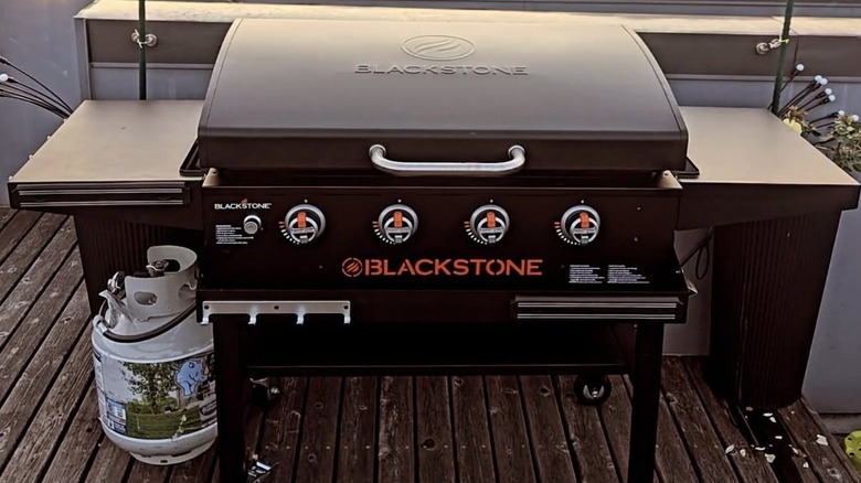Blackstone griddle sitting outside on a deck in the elements