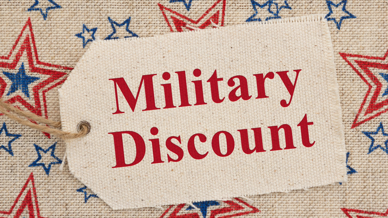Words military discount on burlap with red white and blue burlap placemat behind