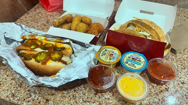 Assorted boxes of hot dogs, appetizer sampler, and tacos from Sheetz