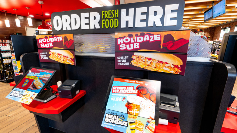 Sheetz ordering kiosks, advertising various sub sandwiches