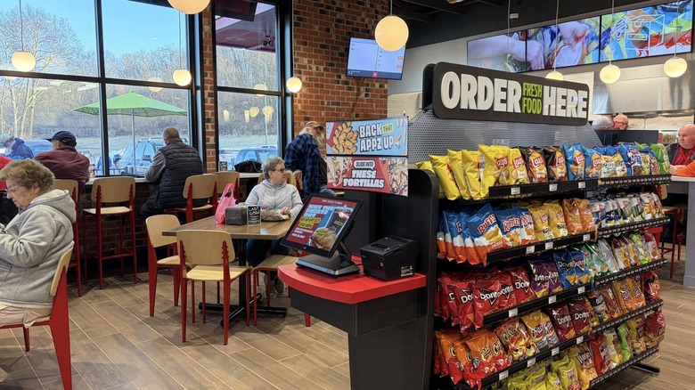 Food shelves and dining customers inside a Sheetz