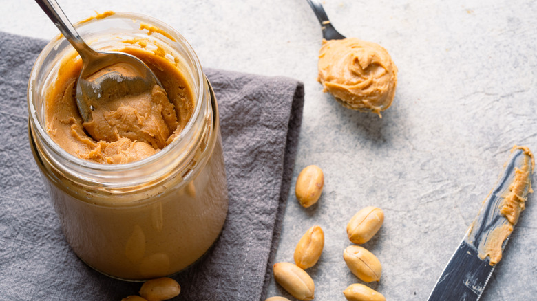 jar of peanut butter with silverware