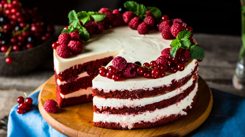 A red velvet cake on a wooden board