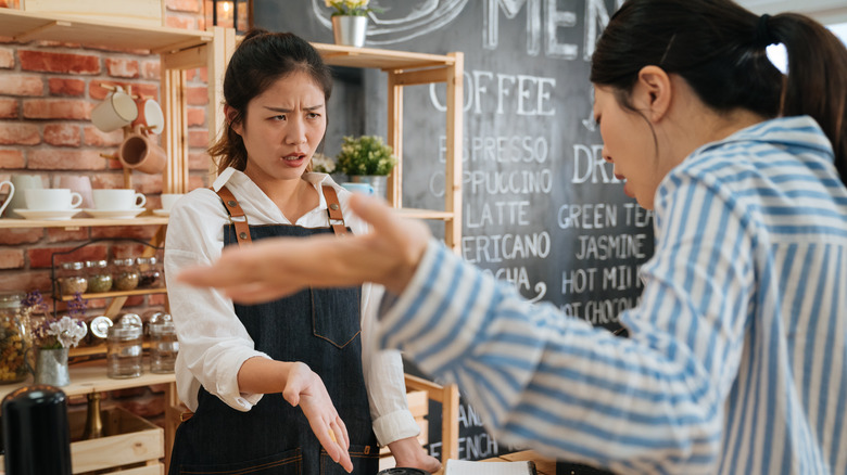 Barista dealing with angry customer