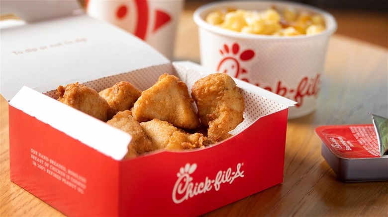 Chick-fil-A nuggets with mac and cheese on wooden table