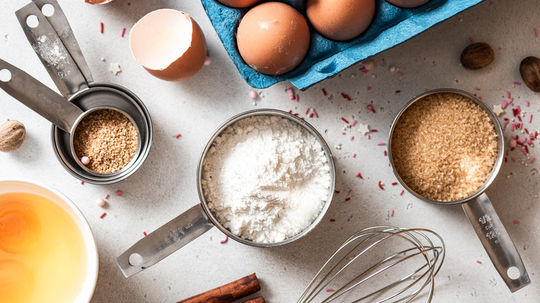 Measuring cups of baking ingredients