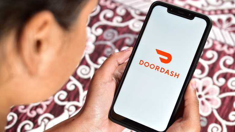 person using doordash app