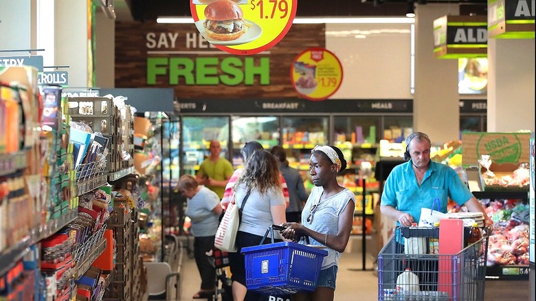 Customer looking at Aldi products 