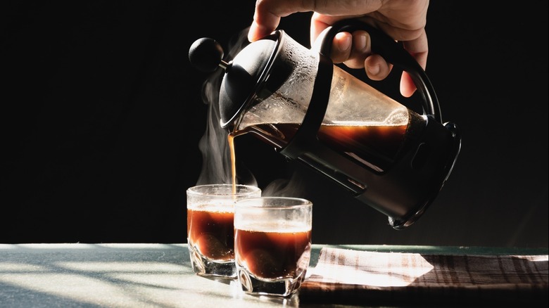 Handing pouring coffee from French press