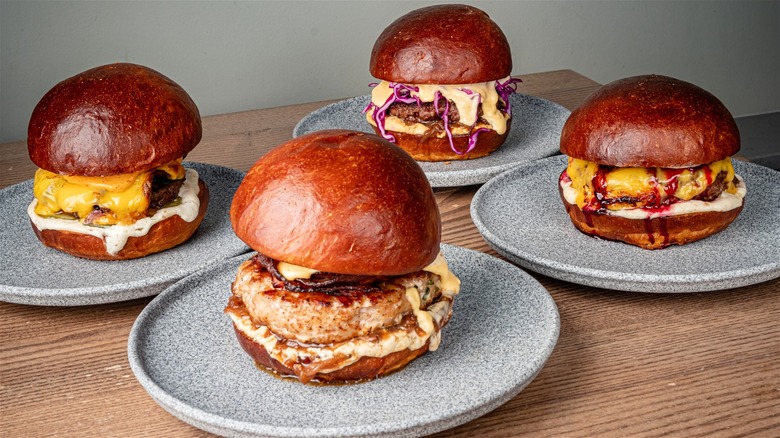 Assorted burgers with novel toppings.
