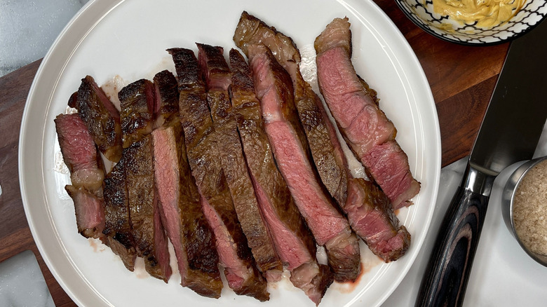 Sliced steak on plate