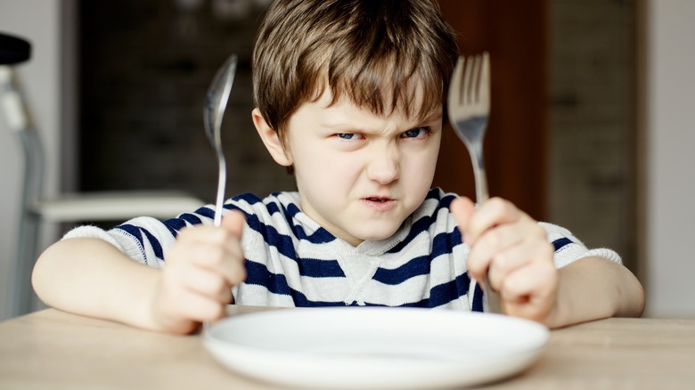 little boy waiting for food