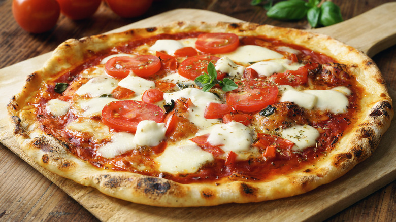  pizza with tomatoes and mozzarella cheese