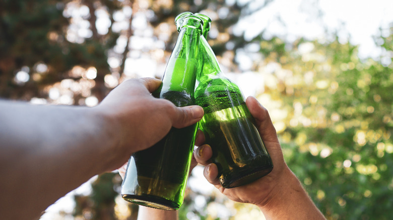 drinking beer in outdoor setting