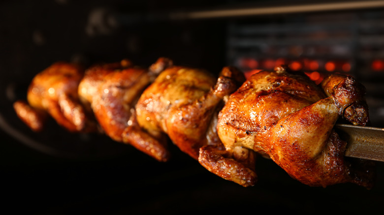 Rotisserie chickens cooking
