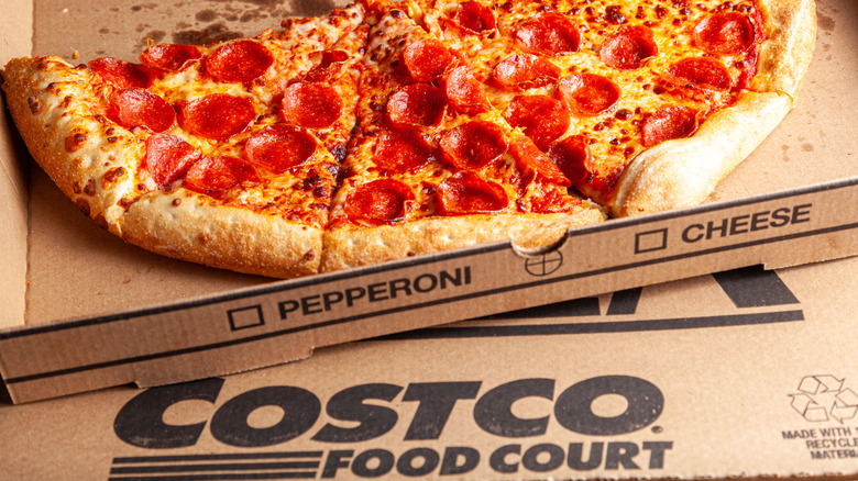 A pizza over a Costco food court box