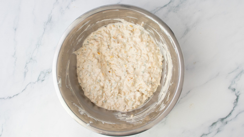 Creamy corn dip in bowl