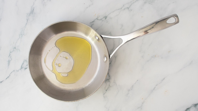 Drizzle of oil in skillet